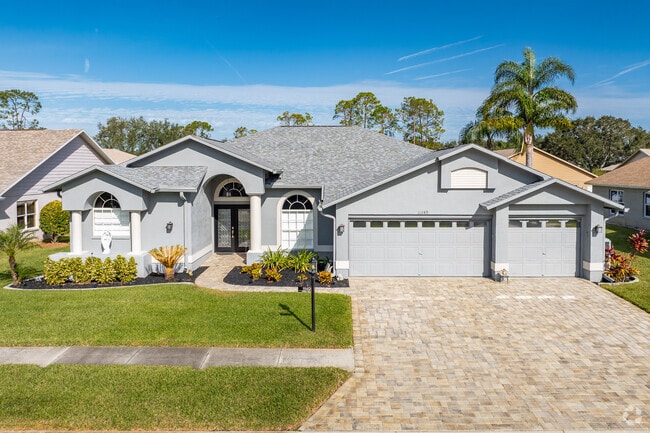 The larger estate homes have lush landscaping in Heritage Pines.