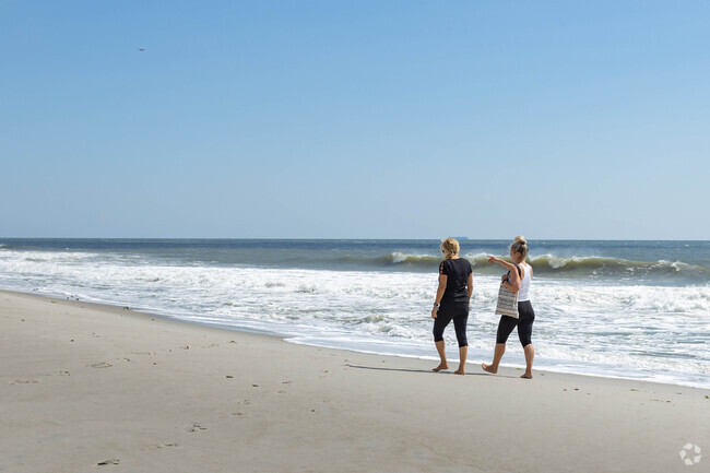 Barnum Island residents enjoy a calm and relaxing walk by the shore.