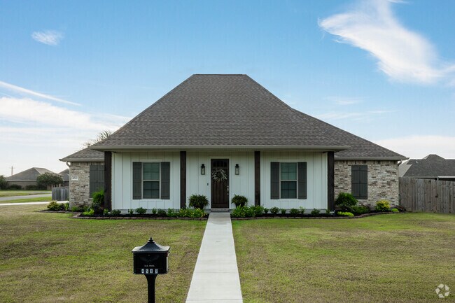 Newer colonial revivals can be found in the interior neighborhood roads of Carlyss.