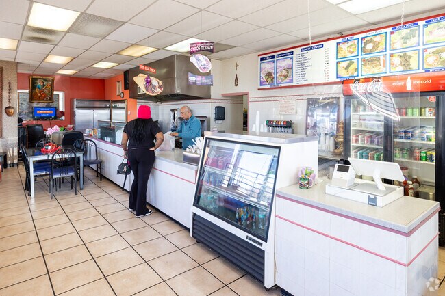 Grab some lunch at Grand Gyro, they near the center of the Rustic Hills neighborhood.