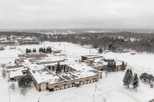 Marquette Senior High School features a large campus with ample parking for sporting events.