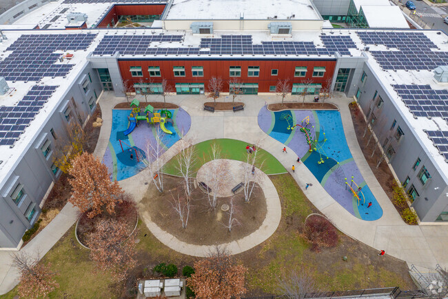 Two playgrounds can be accessed from the right side of the East Somerville Community School.