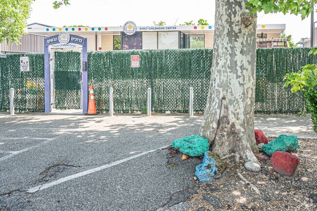 Decorative stones surround a tree at Shulamith School in Woodmere.