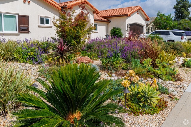 Creative landscaping in front of Spanish style home in Rolling Hills.