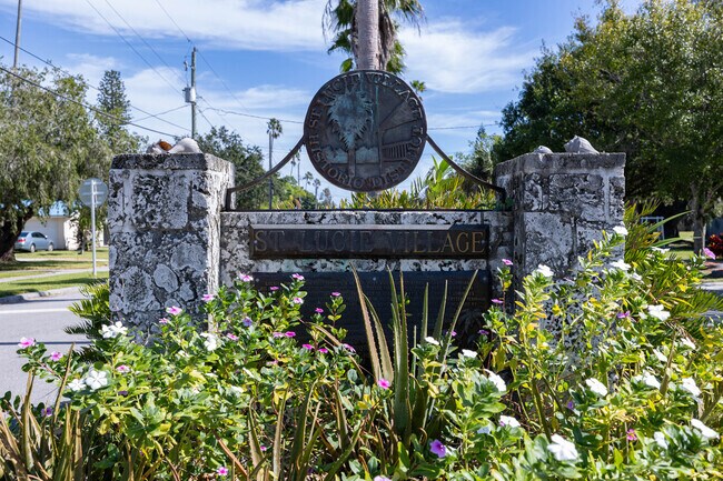 St. Lucie Village sign marks Chamberlain Blvd near the Indian River.