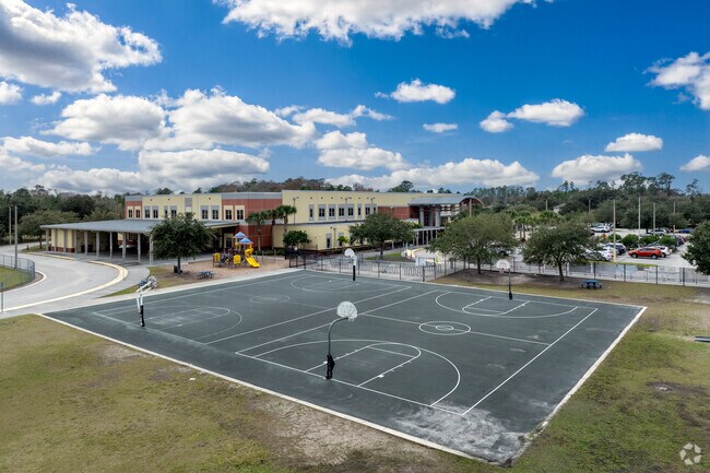 The basketball court sees frequent use during PE at Moss Park Elementary School.