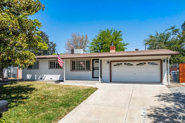 This ranch-style home has a 2-car garage and fireplace in Reservoir.