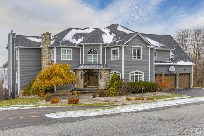 Snow-covered homes in Williston create a cozy winter atmosphere for residents.