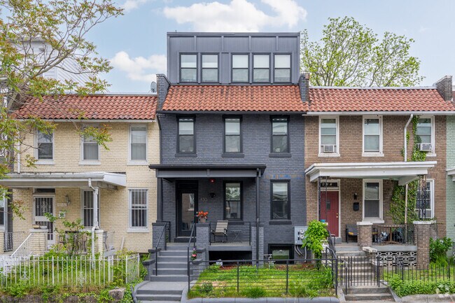 This black row home on Warder St NW in Park View has been re-modeled, with an addition on top.