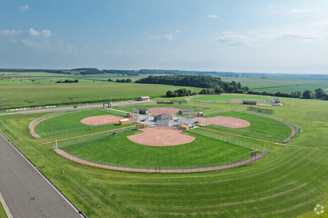 There are four baseball fields adjacent to Bloomer Elementary School.