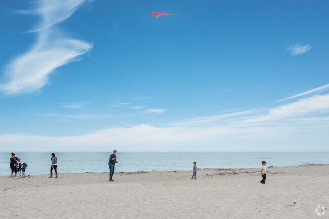 You can find people flying kites at Hollywood Beach near Channel Islands.