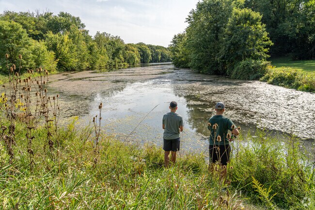 Two boys try their luck at fishing in the lake at Stoever's Dam Park near Avon.