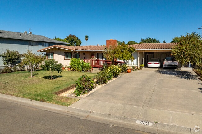 Homes in Willows often feature neat lawns with plants and trees.