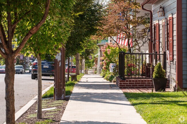 Sidewalks shaded by mature trees make Maytown very walkable.