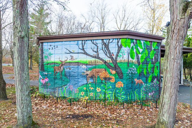 A painted mural at a park in Amherst, New York creates a playful atmosphere.