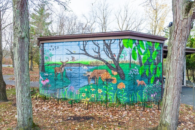 A painted mural at a park in Amherst, New York creates a playful atmosphere.