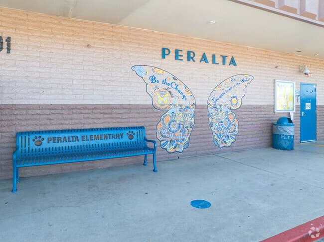 Peralta School shows their school pride with murals on their walls and branded benches.