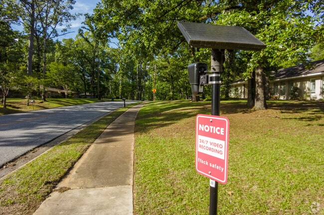 Hillwood sidewalks are monitored by Flock security cameras.