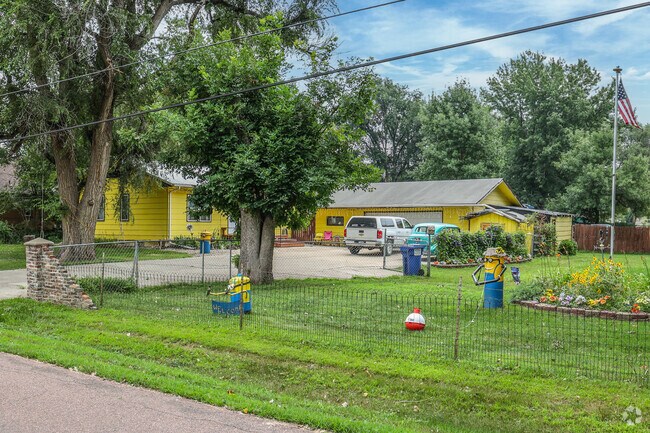 Some Norton Tract neighbors take custom design to the max with lawn art and matching home color.