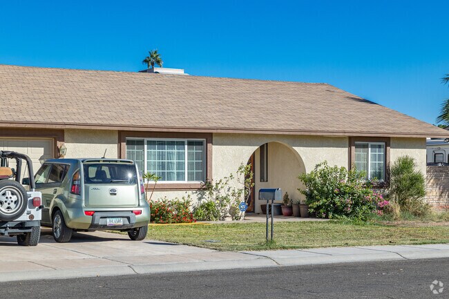 Small front lawns and attached garages are features of Country Estates, AZ houses.