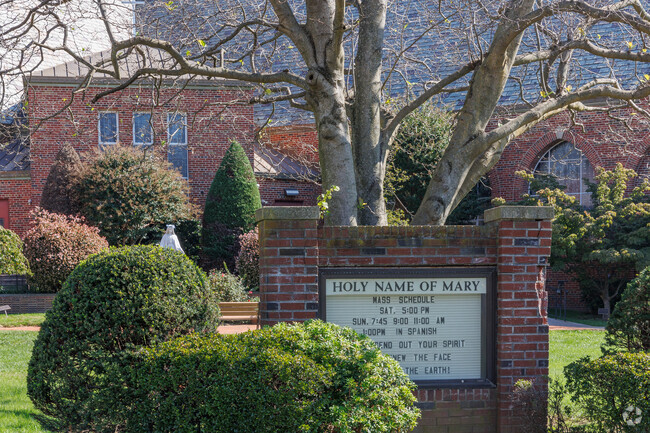 Services board at the Church of Holy Name of Mary School.