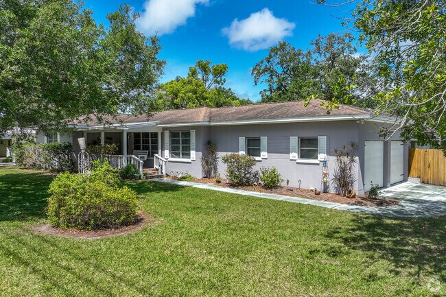 Ranch style homes have manicured front lawns and spacious driveways in Oak Acres Estates.