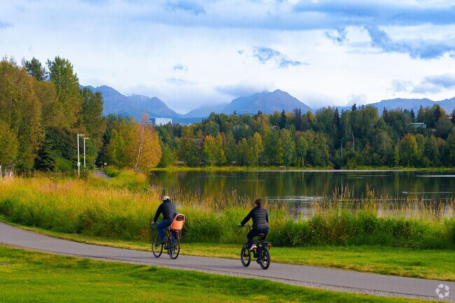 Families bike together at Margaret Eagan Sullivan Park.