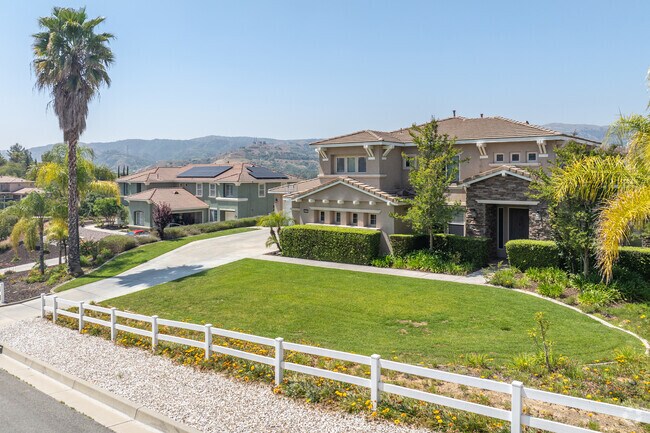 Along the hills of Live Oak Canyon, you'll find a row of multi-story single-family homes.