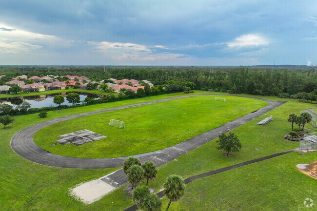 Football field at Jeaga Middle School is surrounded by track for athletic activities.