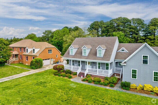 Updated Cape Cod homes in Bayville liven up the tree-lined streets.