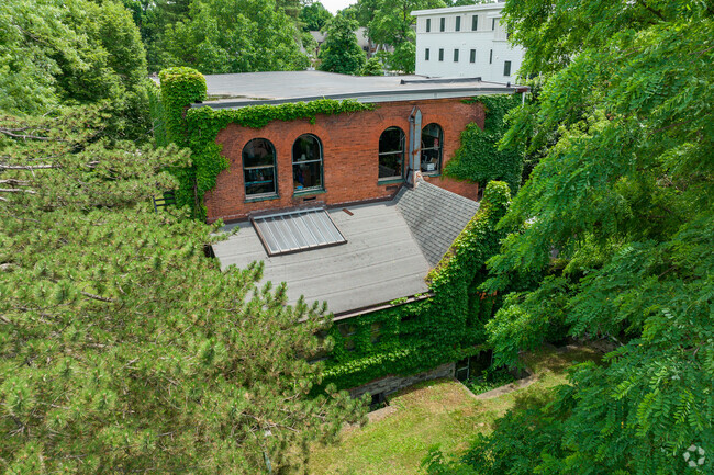 Cascadilla School is a brick building with lots of ivy.