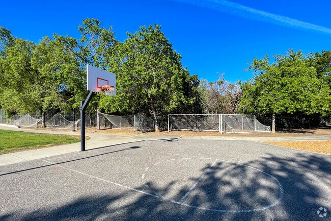Play a game on the standard size basketball court at Creekside Park in Downtown Cupertino.