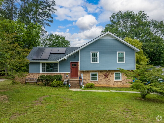 Newer split level homes featuring Solar panels dot Camelot streets.