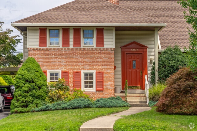 Colorful doors and shutters make homes it Whitfield unique.