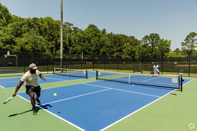 Argyle Forest residents enjoying the weather as they play pickleball.