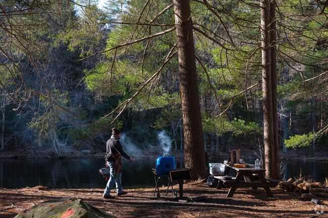 Resident prepares early dinner at Dean Pond Day Use Area. in Monson.