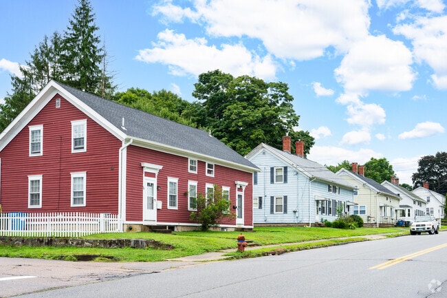 Rows of two-story duplexes define much of Taftville's housing stock.
