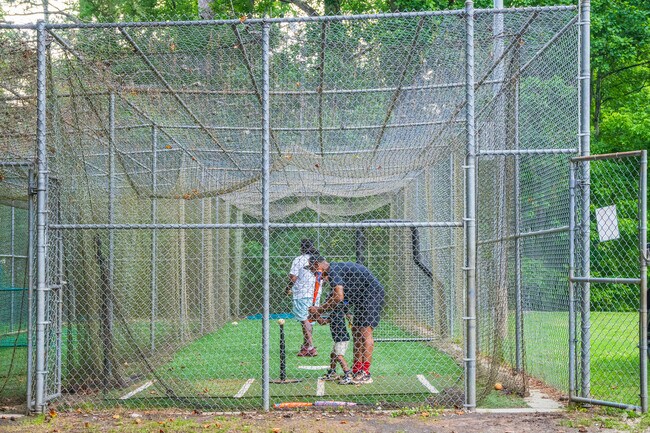 Families and friends like to participate in batting practice inside the cages at Adams Park in Campbellton Road.