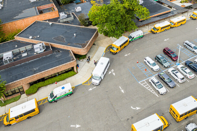Buses lines up outside Henry Viscardi School during school closing time