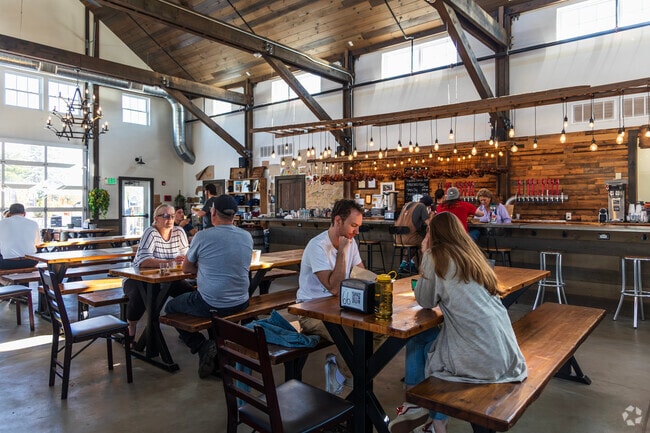 Behind Carlson Orchards, you'll find the Cider Barn Taproom with plenty of food and drinks.