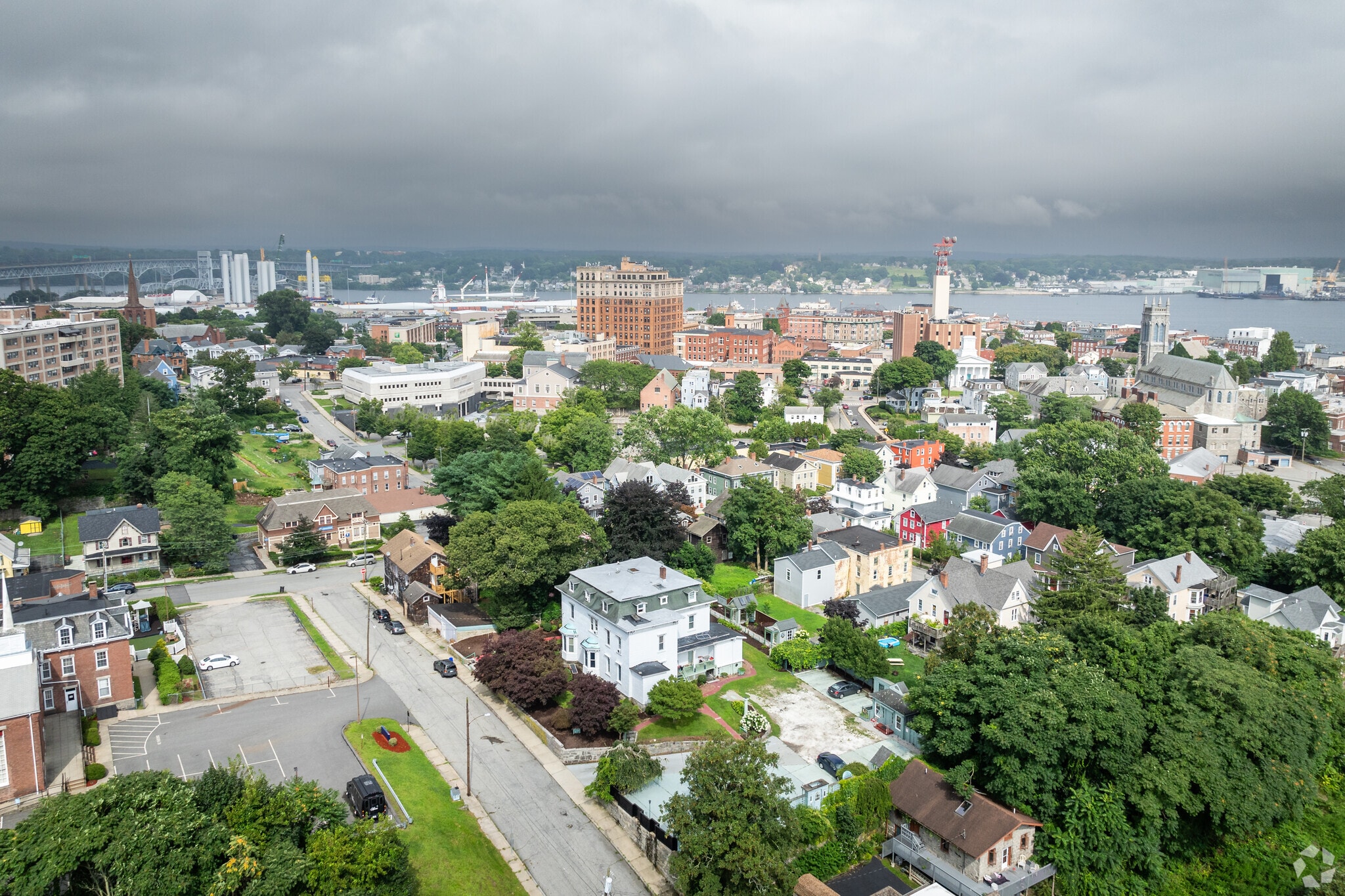 Aerial shot of New London, CT, featuring the Thames River in the distance.