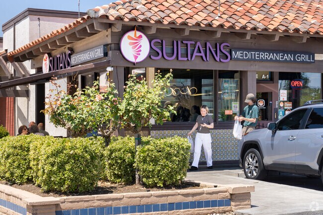A CSU Bakersfield couple pick up their order at the nearby Sultans Mediterranean Grill.