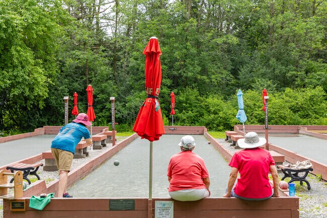 A group of friends gather to play Bocce at Oakledge Park in Five Avenues.