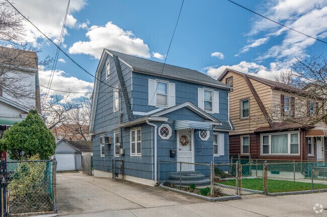 Prewar detached homes line quiet streets that offer a bit of suburban living in Ozone Park.