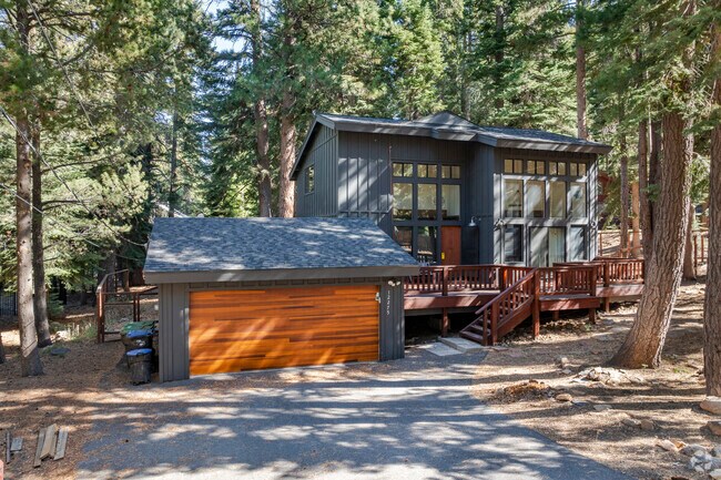 Many cabins have modern upgrades like this all wood garage door in Prosser Lakeview.
