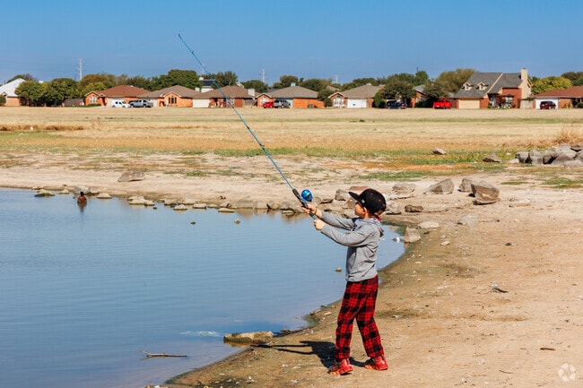 Earl Crow Park's serene lake offers residents a peaceful spot for fishing.