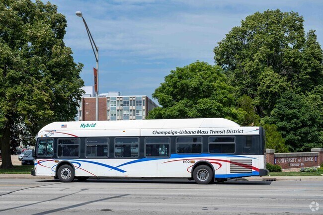 MTD bus traveling through a Champaign neighborhood near Seagrass area.