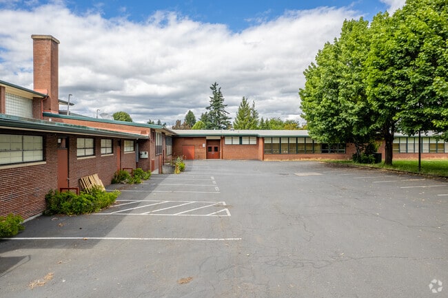 Rear parking lot with additional parking spots for faculty and parents visiting.