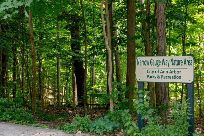 The park sign at Narrow Gauge Way Nature Area marks the trailhead at the park.
