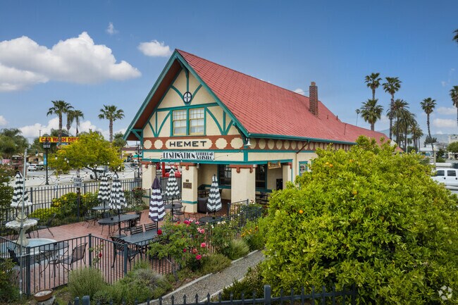 Gated Patio with Umbrellas Seen at Destination Smokehouse & Eatery in Downtown Hemet